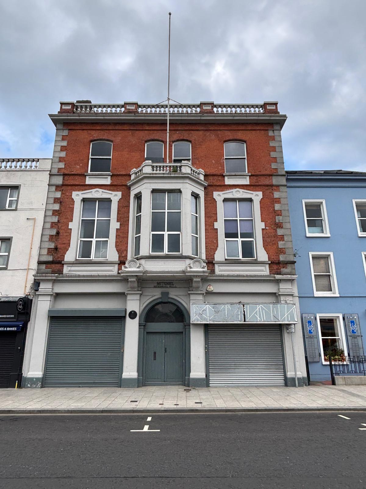 The historic red-brick facade of the Newry building today